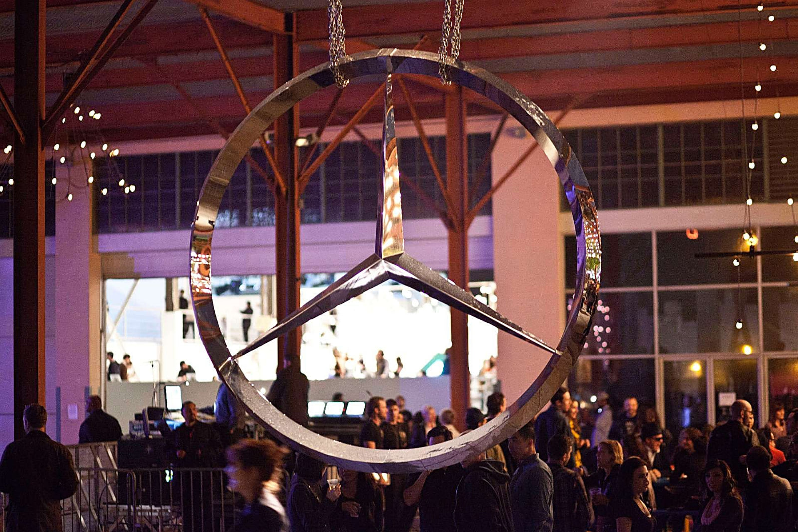 The star over the entrance, the stage at night, the star against the sky, and the artists outside