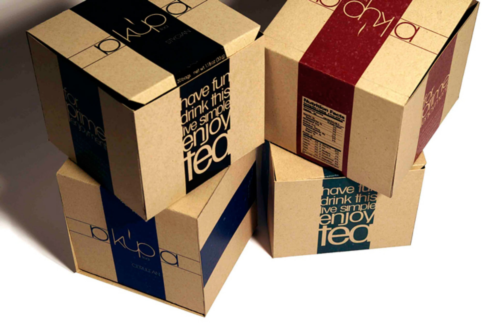 Four boxes stacked, a different band on each and the wordmark on every lid